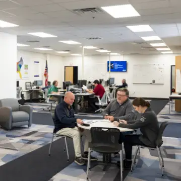 Picture of Milliken logistics employees meeting at a table