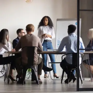 group of people gathered at a table in a business meeting