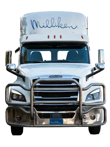 Picture of the front of a white Milliken semi truck