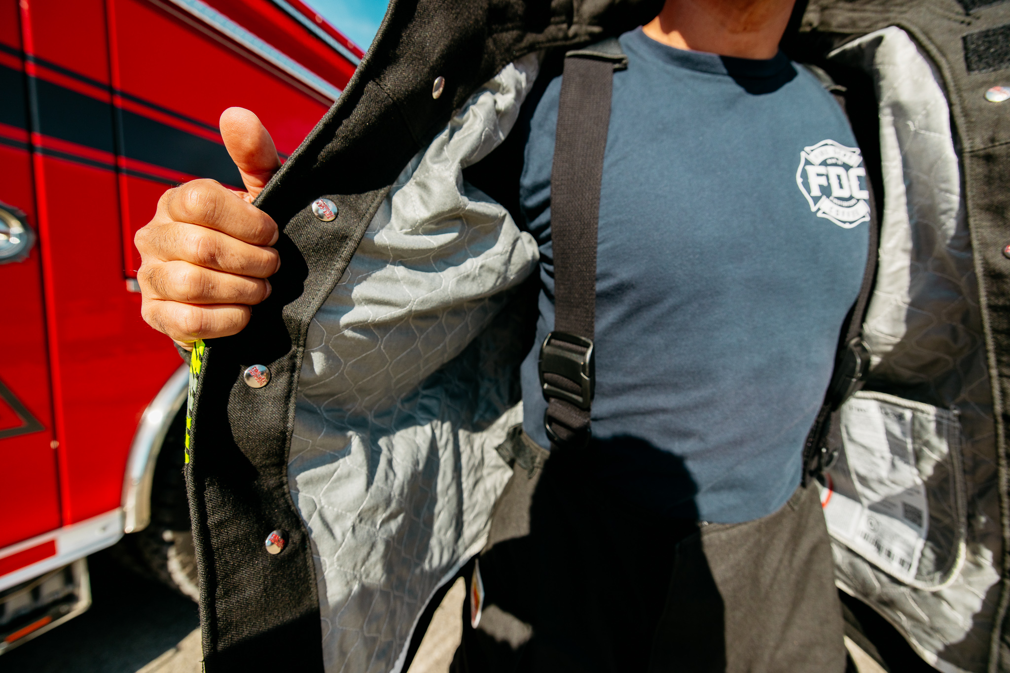 Photo of layers of turnout fabrics on a fire suit