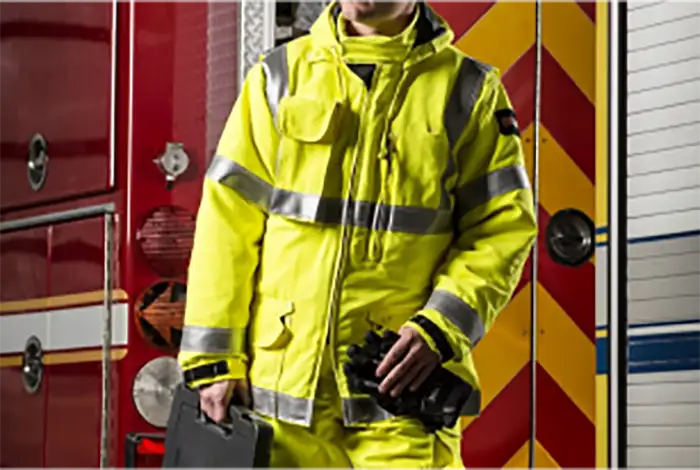 Photo of a firefighter wearing a yellow emergency response suit